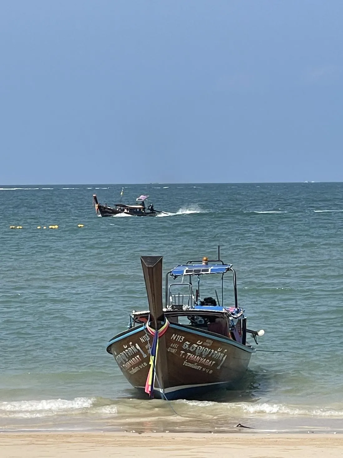 Longtail boat at sea